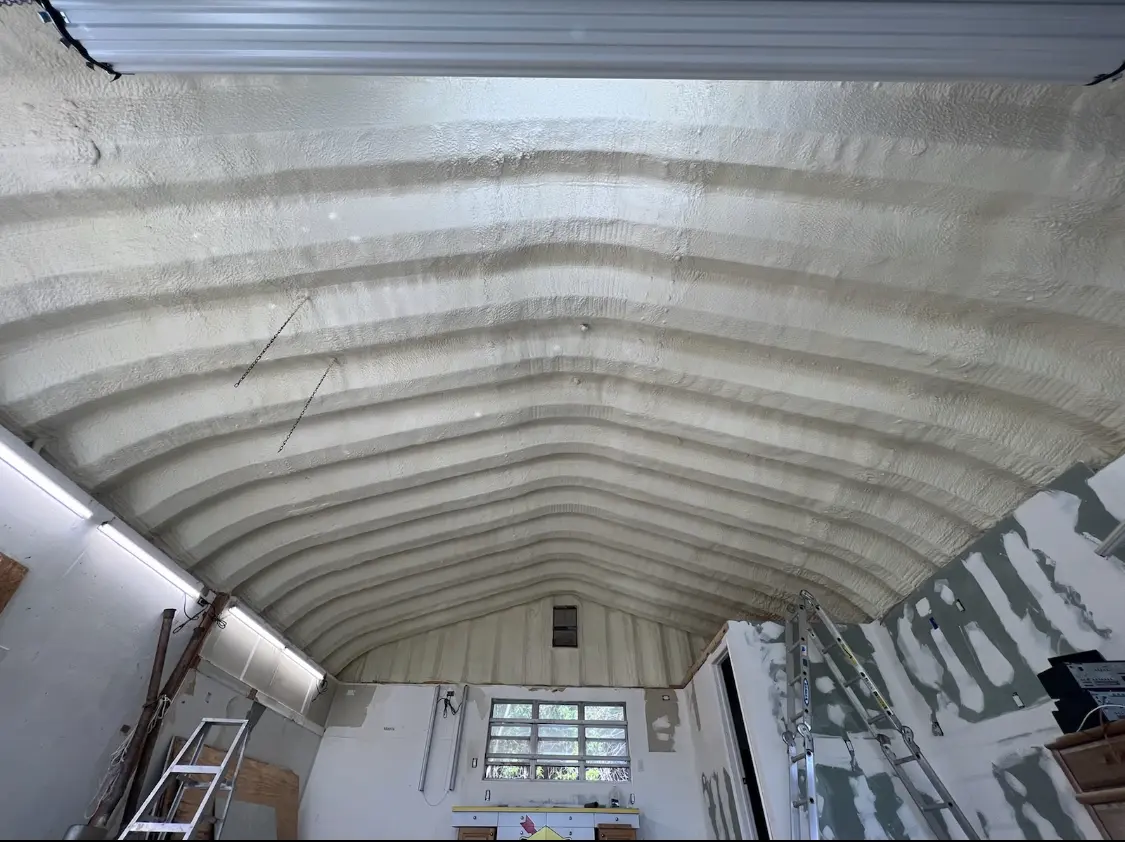Spray polyurethane foam applied to the underside of a metal roof deck in Malvern